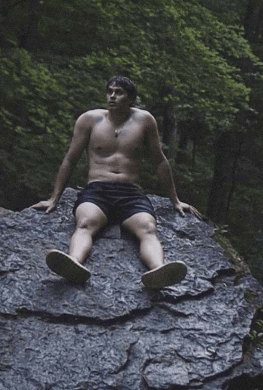 Cross sitting on a rock